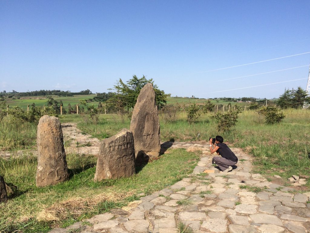 Dr Sada Mire at the decorated cemetery of Tiya, World Heritage Site, Ethiopia, 2015
