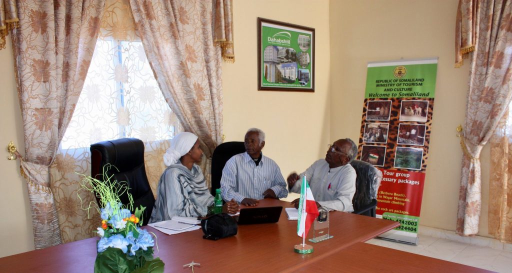 Sada Mire discussing the inclusion of a cultural heritage and archaeology chapter in the primary school curriculum with Minister and Deputy Minister of Education about school curriculum, Somaliland, 2011