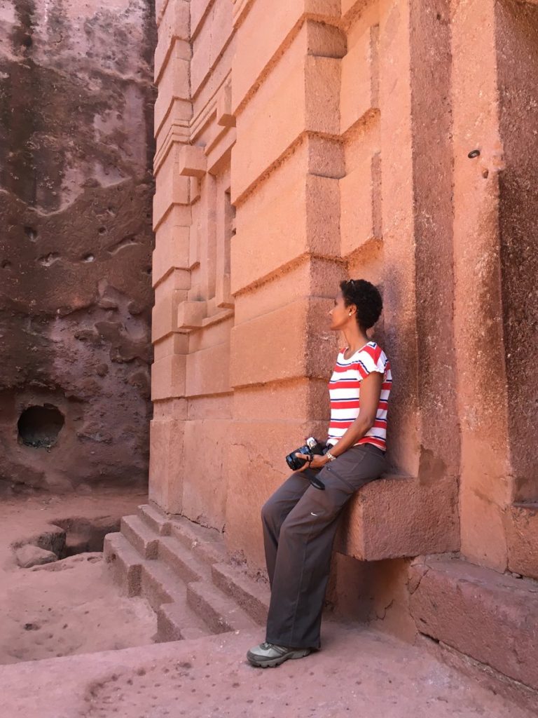 Dr Sada Mire admiring the breathtaking rock hewn churches of Lalibela, Ethiopia
